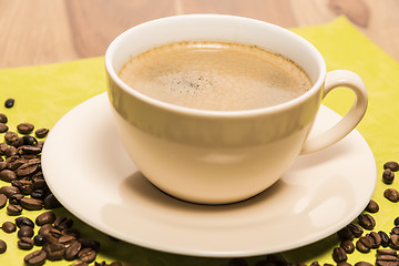 Image showing Cup of coffee with beans