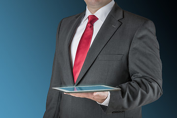 Image showing Business man with tablet