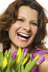 Image showing Smiling woman with flowers