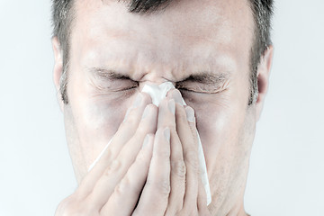 Image showing Man with is sneezing