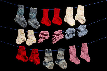 Image showing Baby socks on black background