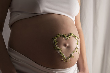 Image showing cress heart on baby bump