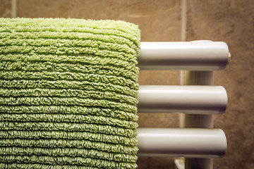 Image showing Green towel on radiator