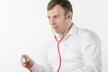 Image showing Man is holding stethoscope