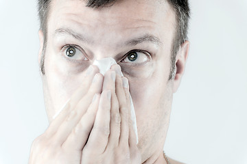 Image showing Man with flu is sneezing