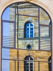Image showing Mirroring of a old house in window