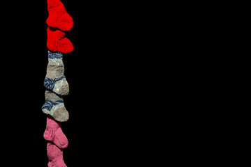 Image showing Three pairs of baby socks on black background