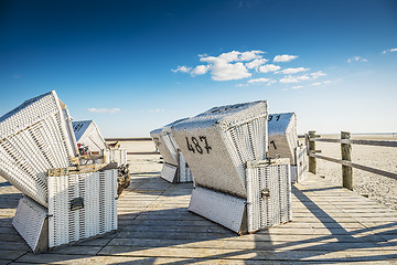 Image showing Beach chairs on wooden ground