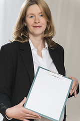 Image showing Pregnant business woman with folder