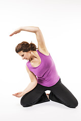 Image showing Woman stretch her back