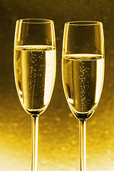 Image showing Champagner with gold background