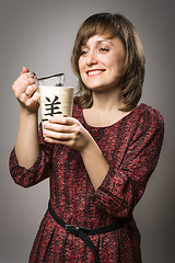 Image showing Woman prepares tea