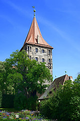 Image showing Tower of Nuremberg Castle with tree and flowers