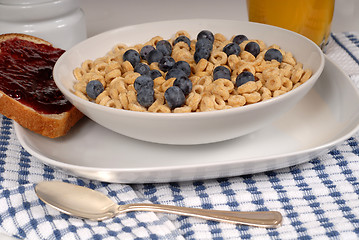 Image showing Oat cereal with blueberries, toast with raspberry jam