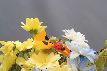 Image showing flower arrangement with ladybug
