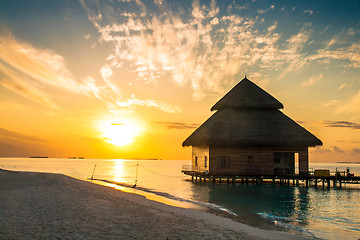 Image showing Sunset on Maldives island, water villas resort