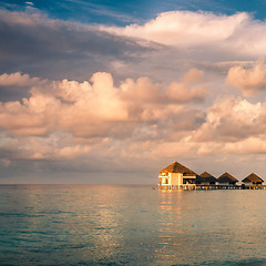 Image showing Sunset on Maldives island, water villas resort