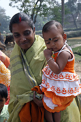 Image showing Mother carries the little girl Sabita Bisvas
