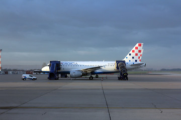 Image showing Croatia Aerlines A319 serviced by the ground crew