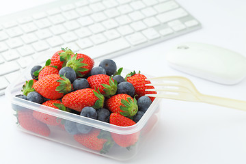 Image showing Health lunch with strawberry and blueberry mix in office