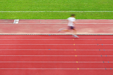 Image showing Running man on tracks in sport field