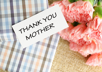 Image showing Gift and pink carnations flower for Mother's Day