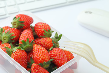 Image showing Healthy lunch with strawberry and blueberry mix in office