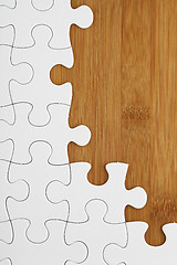 Image showing Puzzle on wooden board