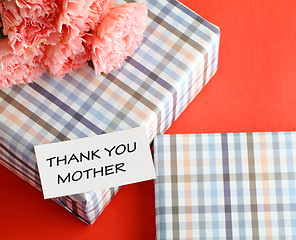 Image showing Gift and pink carnations flower for Mother's Day