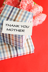 Image showing Gift and pink carnations flower for Mother's Day