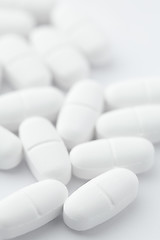 Image showing White pills on white background