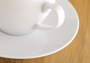 Image showing wooden table with white cup