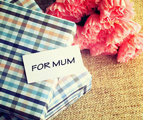 Image showing Gift and pink carnations flower for Mother's Day