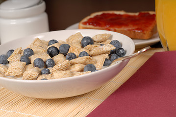 Image showing Wheat cereal with blueberries, toast and orange juice