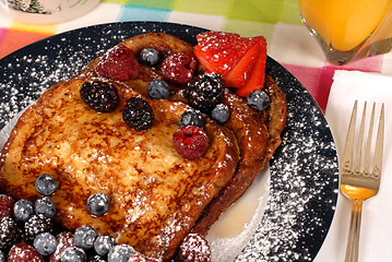 Image showing French toast with fruit and maple syrup closeup