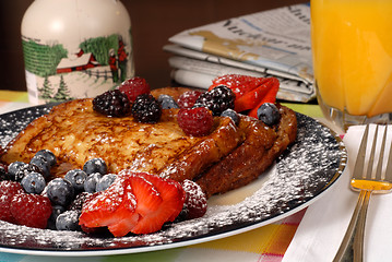 Image showing Plate of french toast with fruit and maple syrup