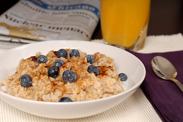 Image showing Oatmeal with brown sugar and blueberries