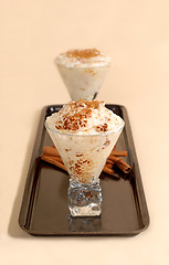 Image showing Two glasses of rice pudding with cinnamon