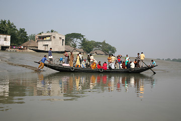 Image showing Wooden boat crosses the Ganges River in Gosaba, West Bengal, India