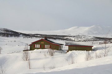 Image showing Winter cabin in the mountain