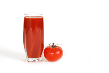 Image showing Glass of tomato juice with tomato next to glass