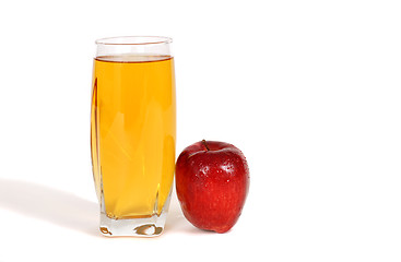 Image showing Glass of apple juice with an apple next to glass