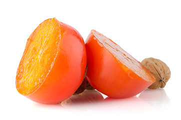 Image showing Ripe persimmons and nuts