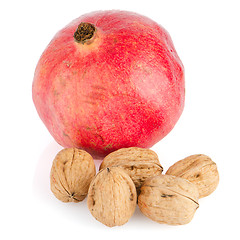 Image showing Ripe pomegranate fruit and nuts