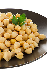 Image showing Chickpeas in a brown plate
