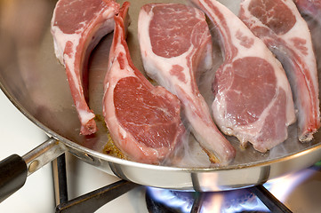 Image showing lamb chops steam rising