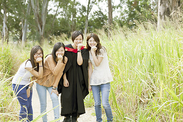 Image showing Asian friends in graduation