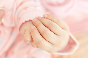 Image showing Baby hand holding mother hand