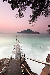 Image showing Sunset pier with strong wave motion