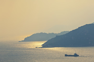 Image showing Sunset over the ocean surface